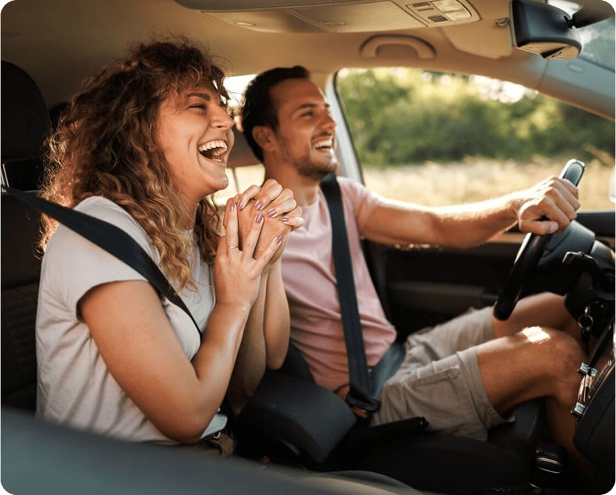 couple smiling in a car
